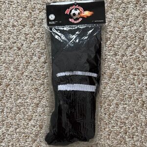Soccer referee socks in solid black and white horizontal stripe.